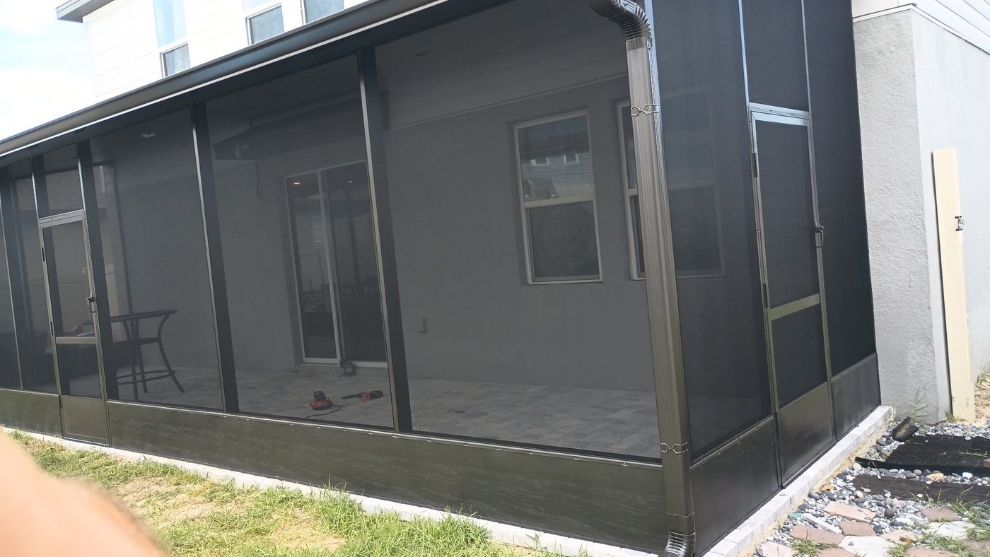 Lanai enclosed with dark bronze aluminum screen framing on a Florida home