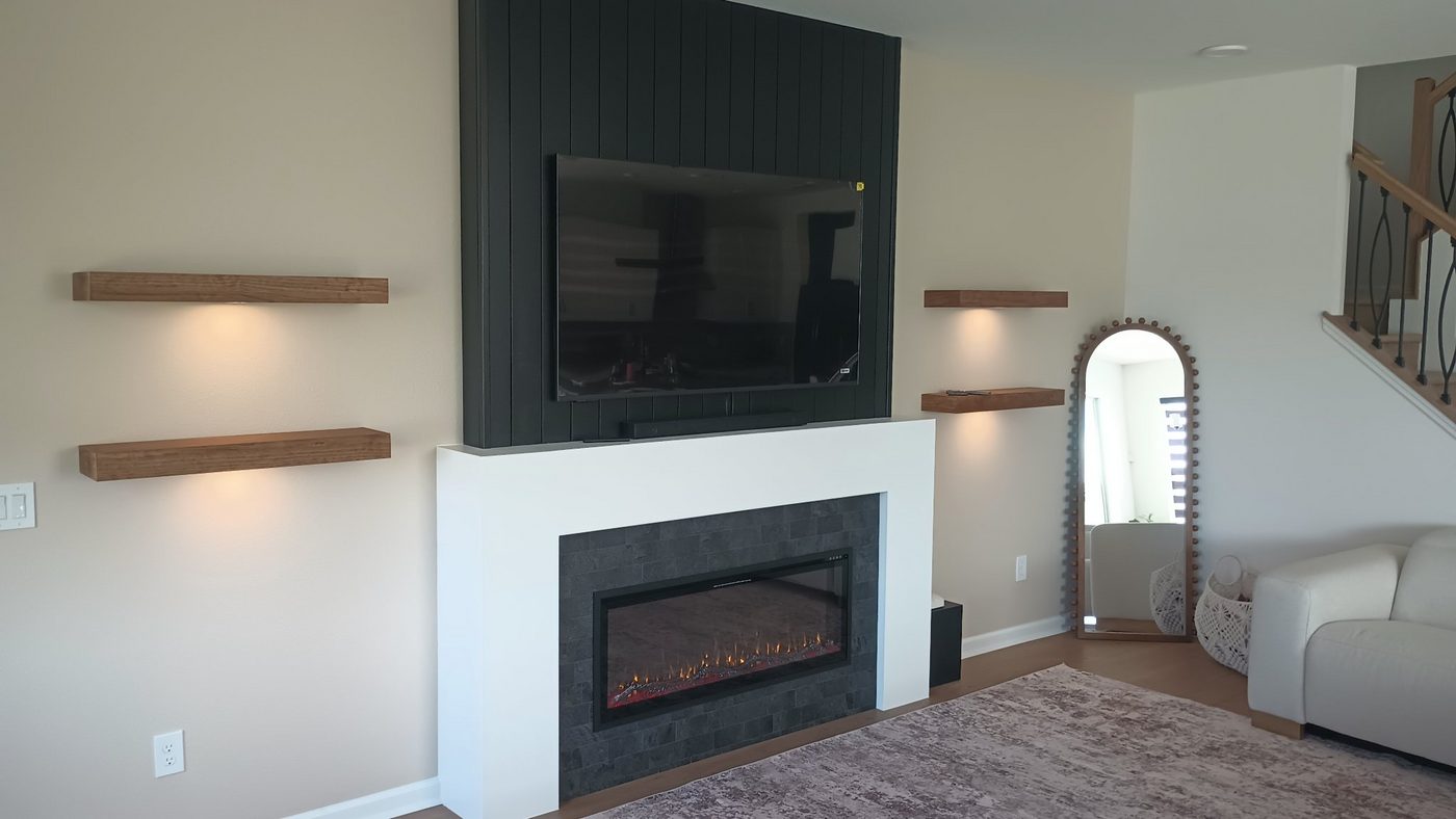 Fireplace bump wall with a TV and floating shelves