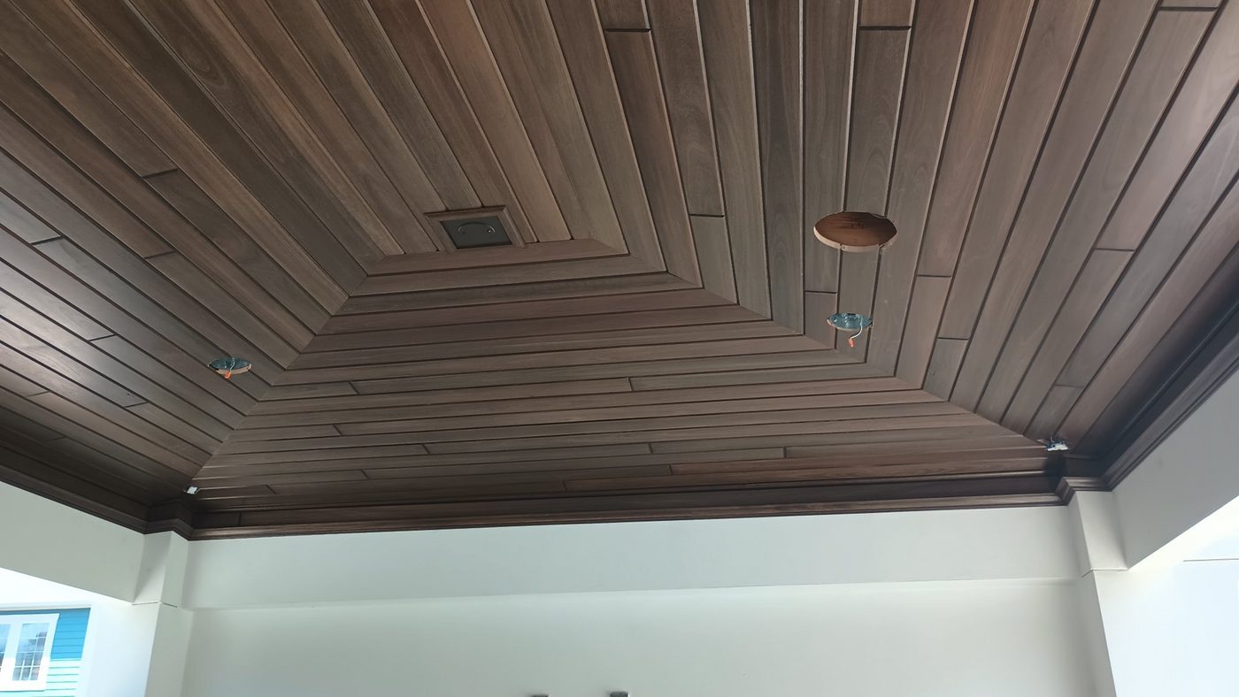 Interior dark wood plank ceiling with recessed lighting