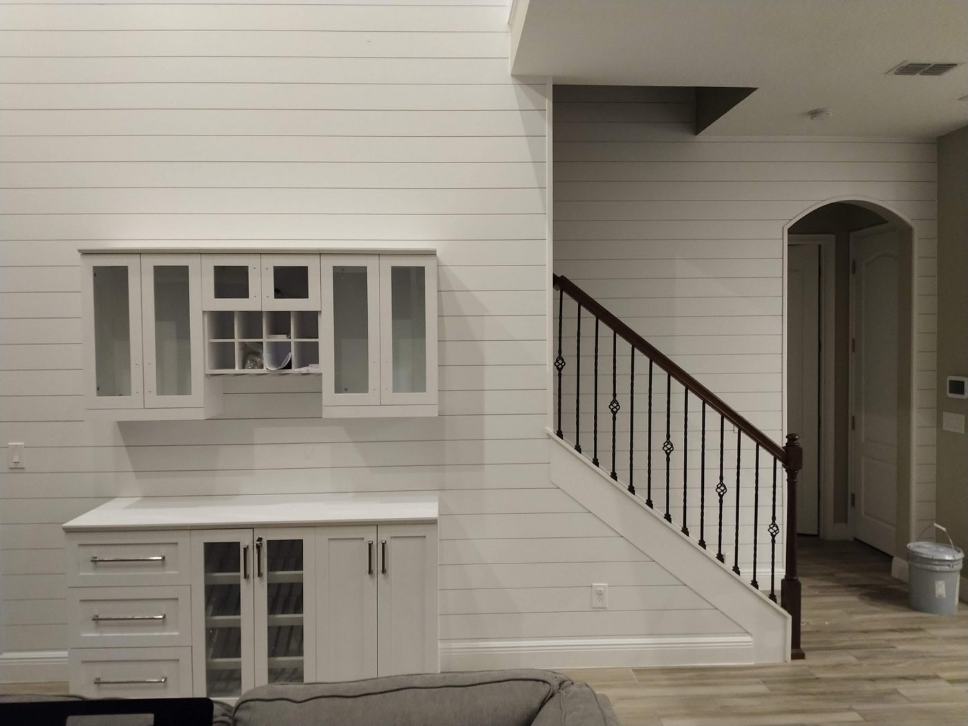 Hallway with white shiplap and a built-in desk