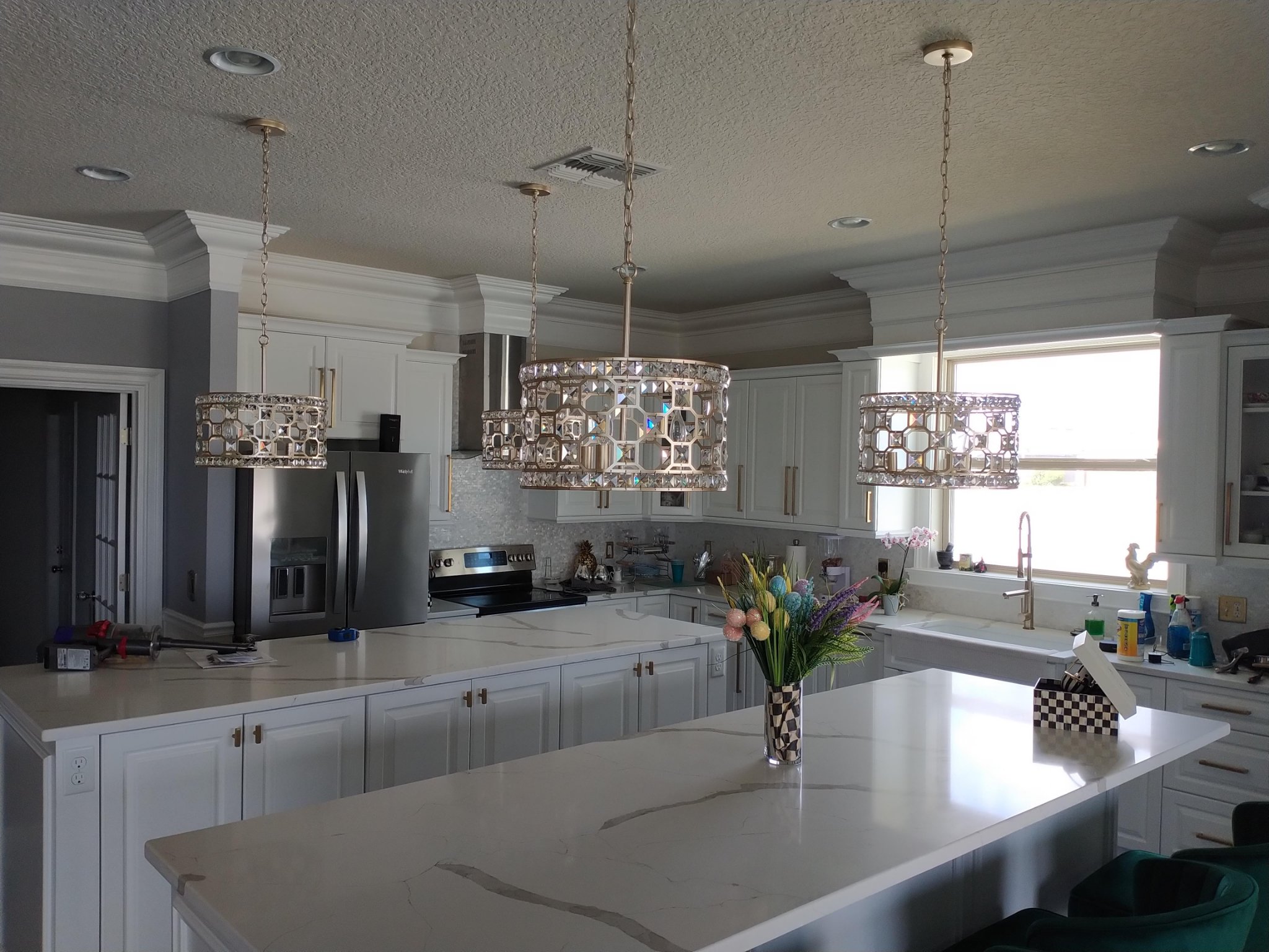 Kitchen with white crown molding over the cabinets