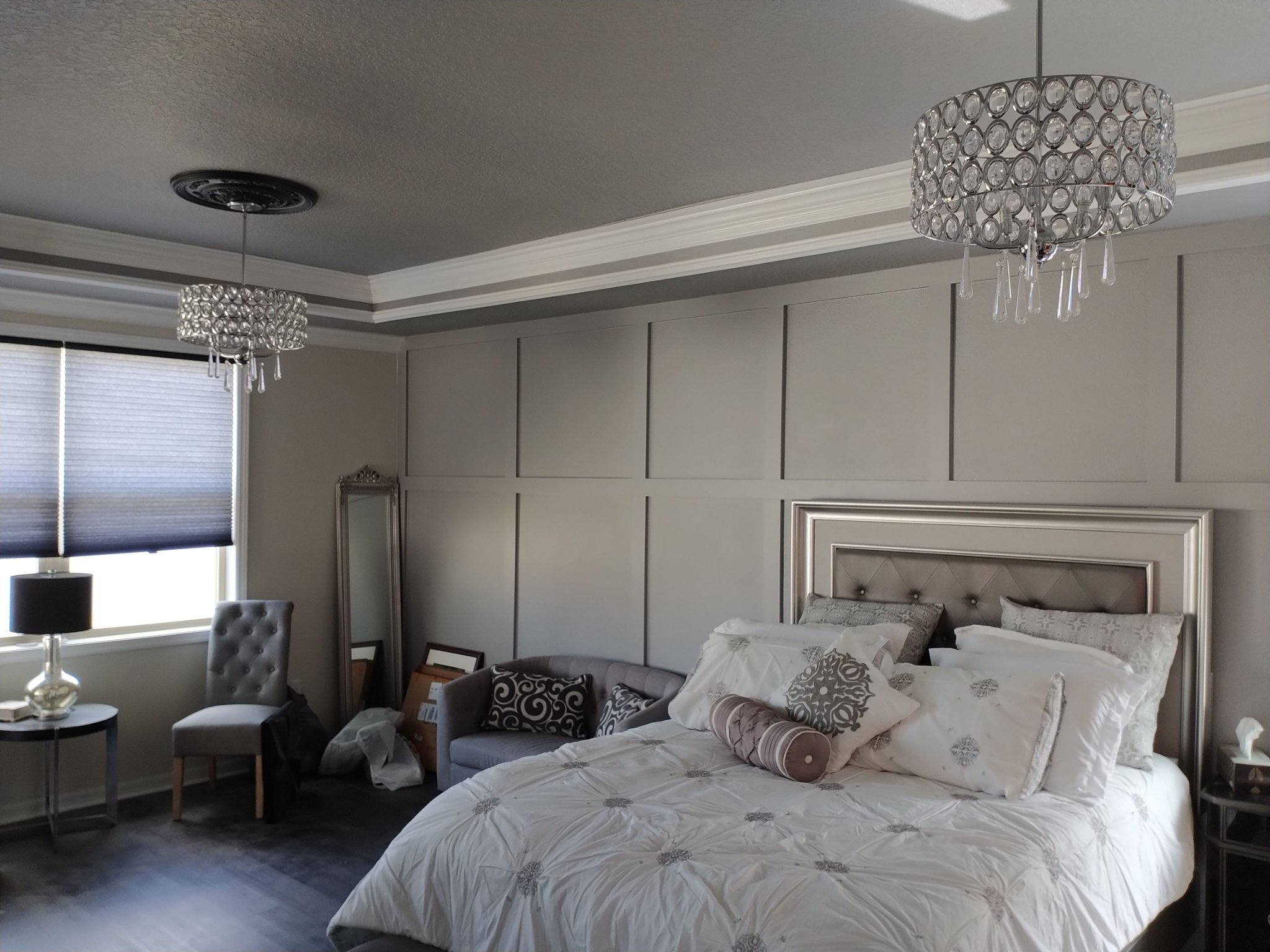 Bedroom with white crown molding and a tray ceiling