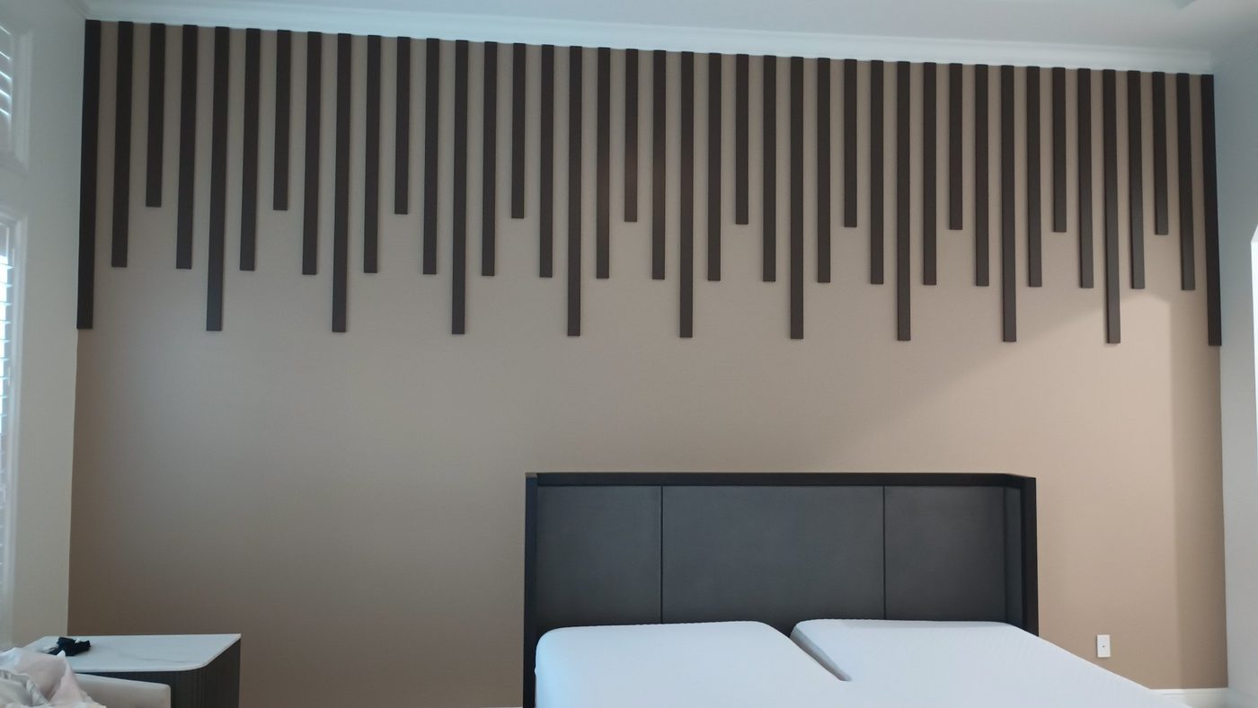 Bedroom headboard wall with vertical wood slat decor