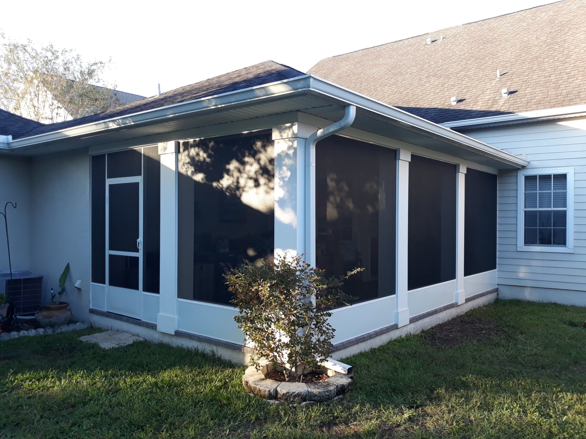 White-column screened lanai and porch enclosure