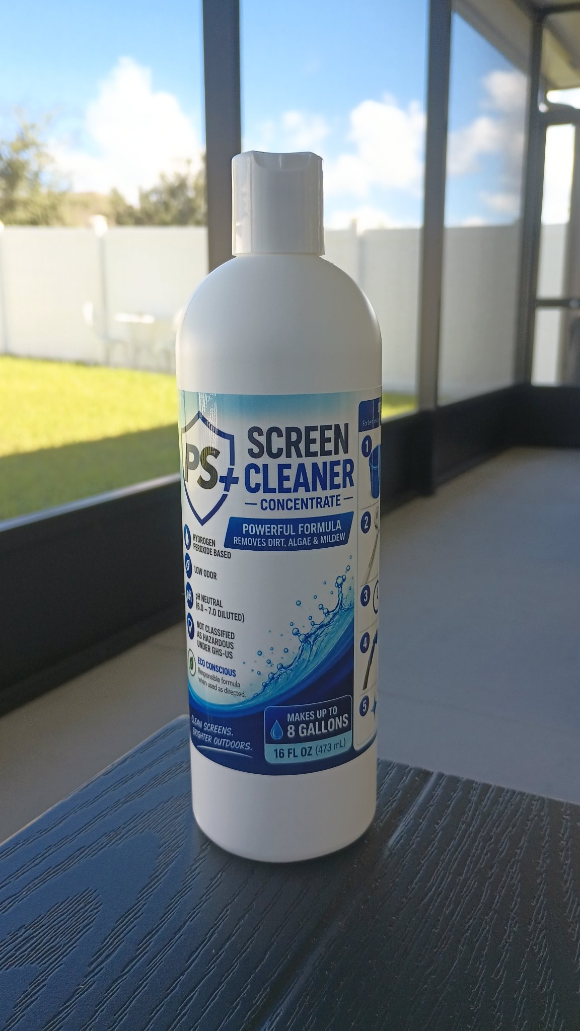 One 16 oz bottle of PS+ Screen Cleaner Concentrate with a white cap, standing on a table inside a screen enclosure