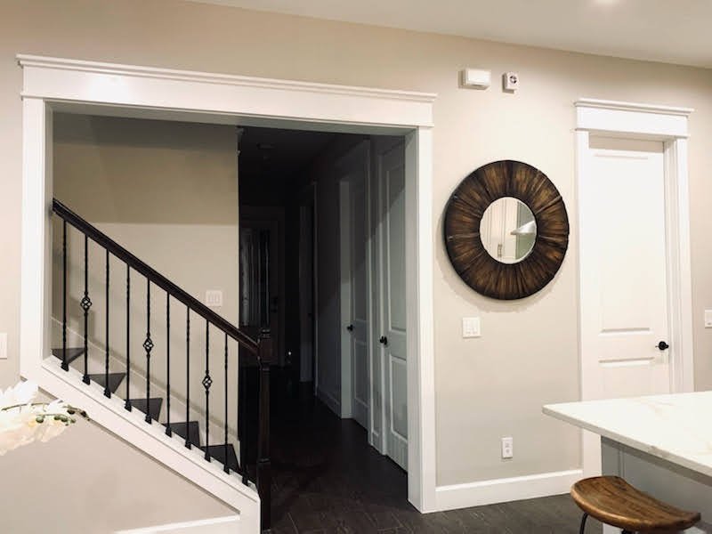 Interior with craftsman-style cased opening and door trim